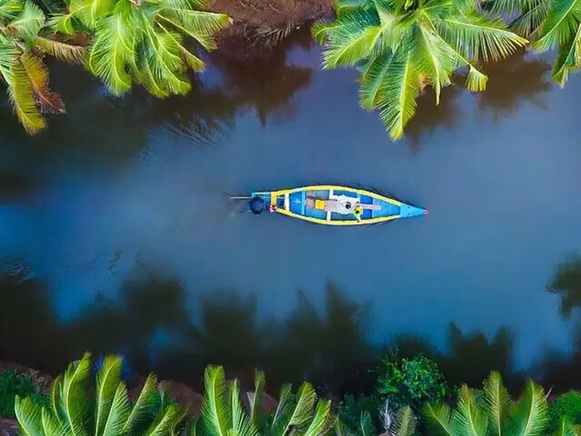 A single boat on the Kerala backwaters, seen from above