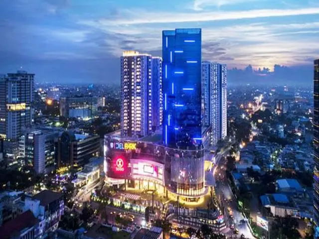 The Medan city skyline lit up after dark, North Sumatra, Indonesia