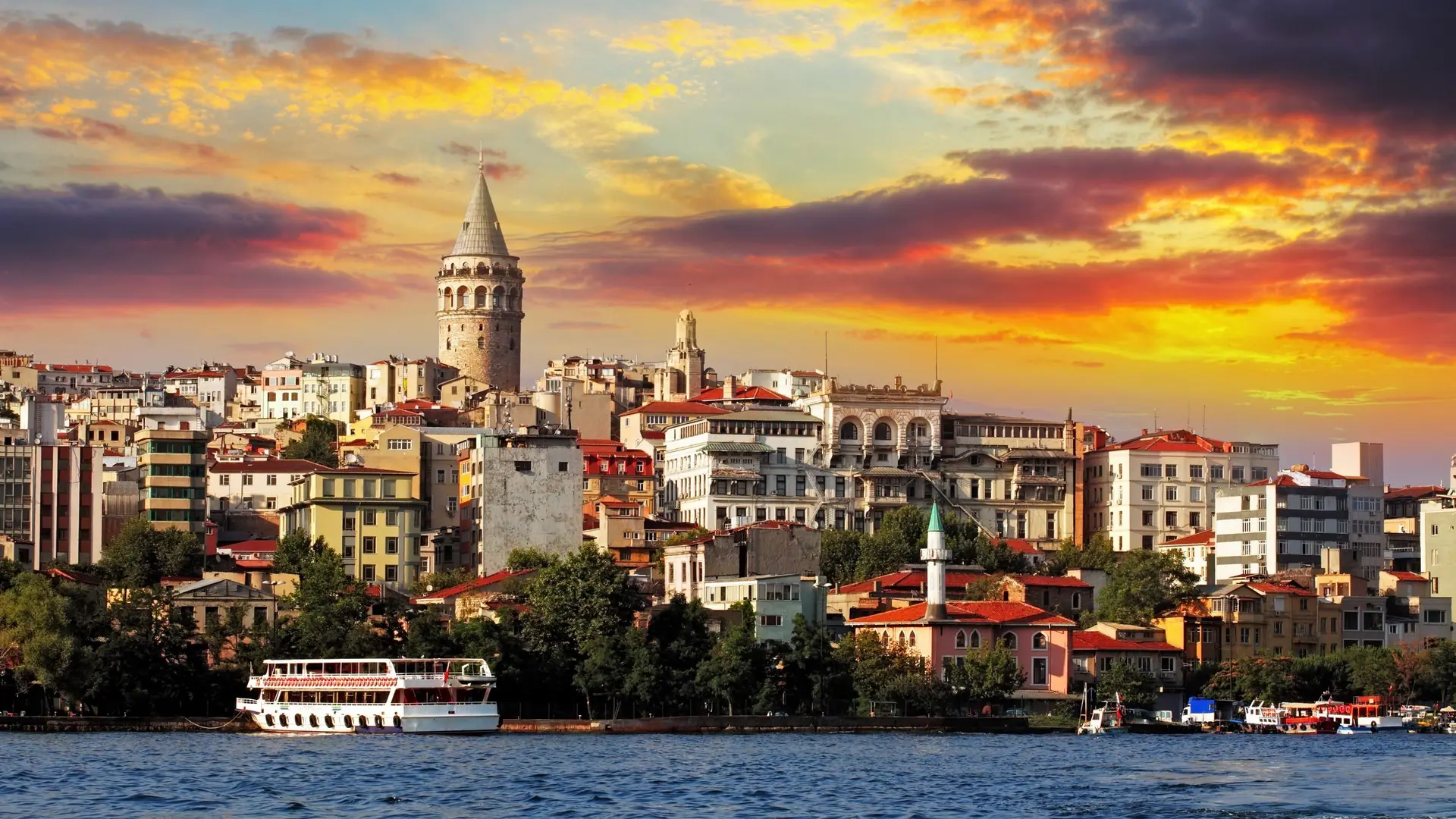 A harbour city skyline at sunset